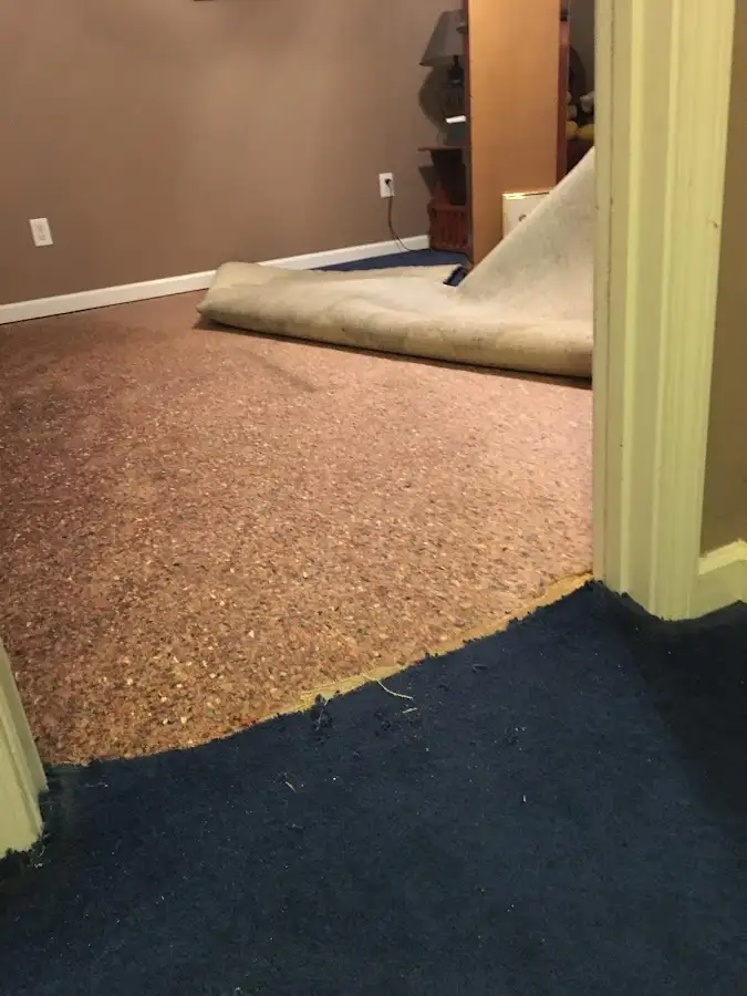 Carpet pad removal revealing water damage during Drying & Dehumidification in Pearl City